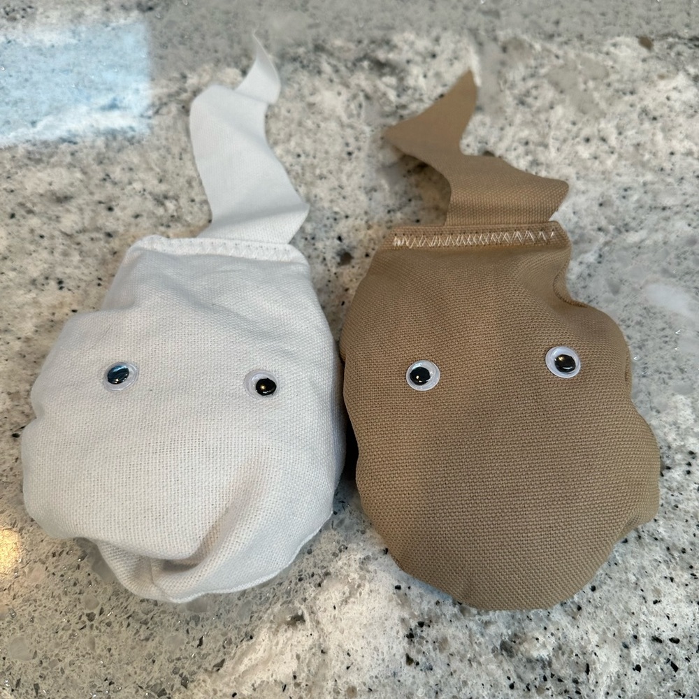 4 white and 4 tan sperm bean bags for bachelorette corn hole